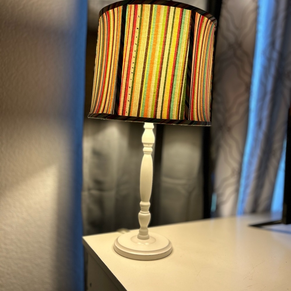 Funky lil white base lamp & fun striped soft pastel lamp shade.  $20